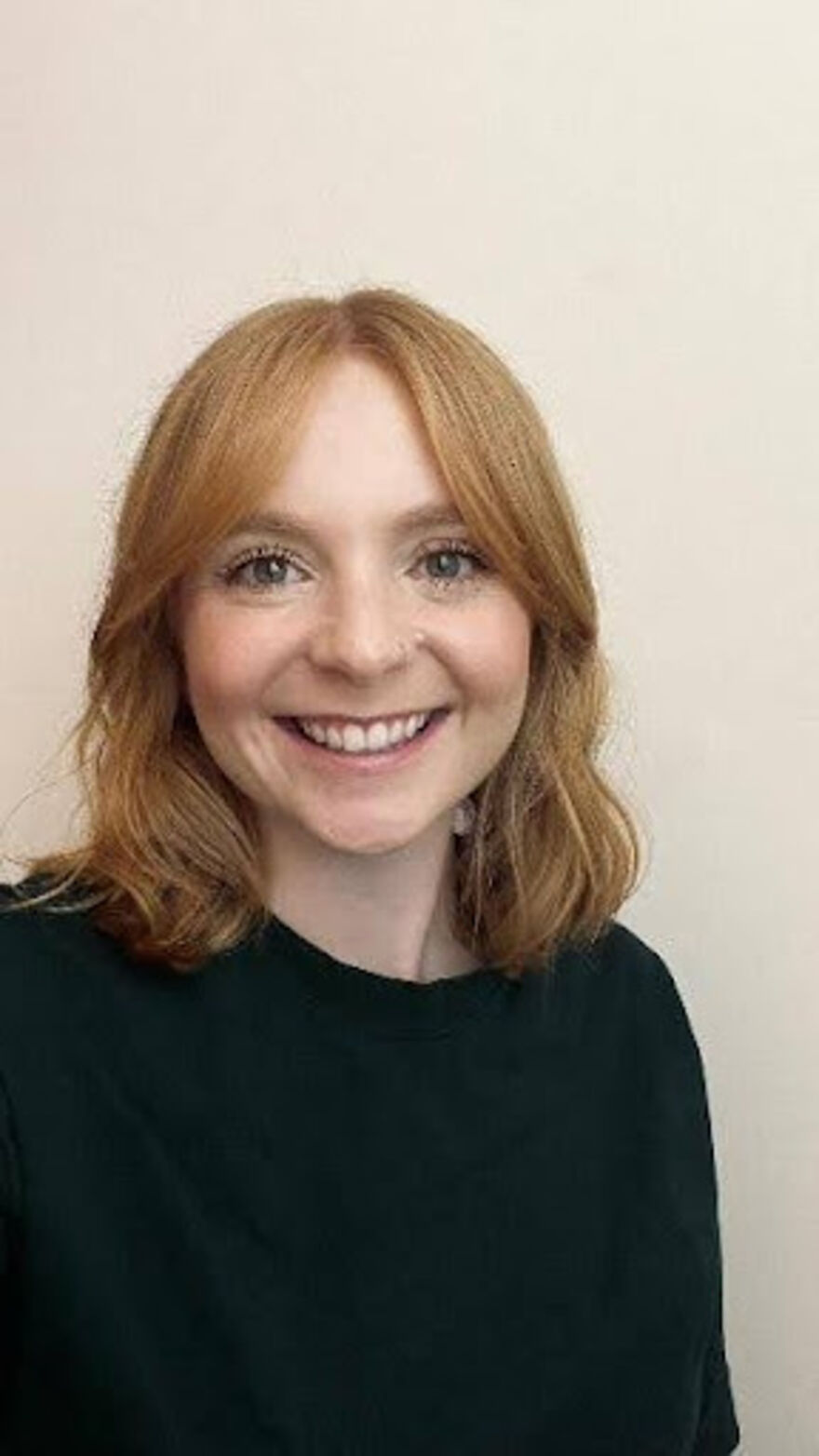 A headshot of Alice Baron smiling