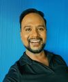 A headshot of Dr Aravind Parameswaran smiling
