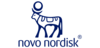 An image of a bull with a sun disk between his horns. Novo Nordisk. registered trademark symbol