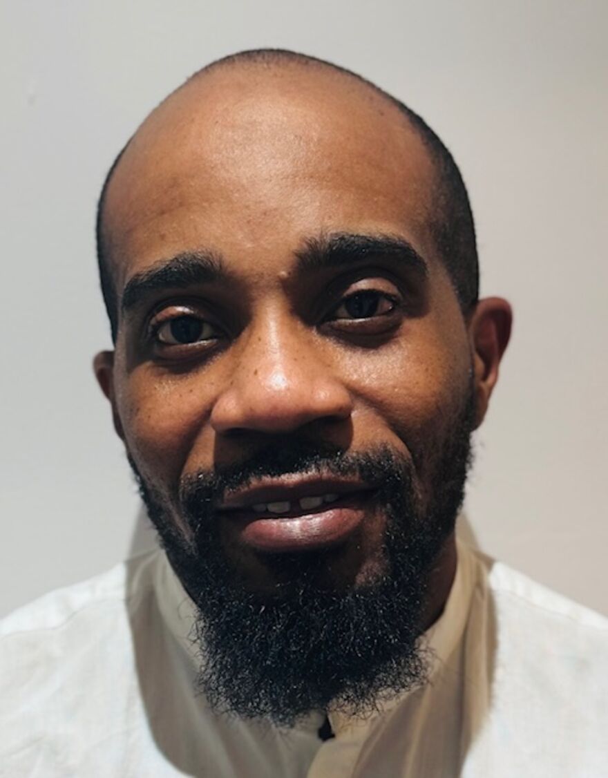 A headshot image of Muiz Agbaje