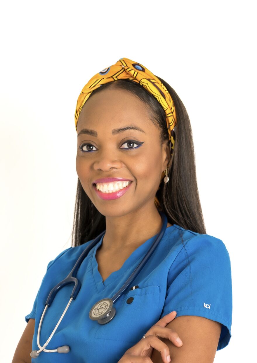 A photo of Dr Aziza Sesay. She is wearing medical scrubs and has a stethoscope around her neck.